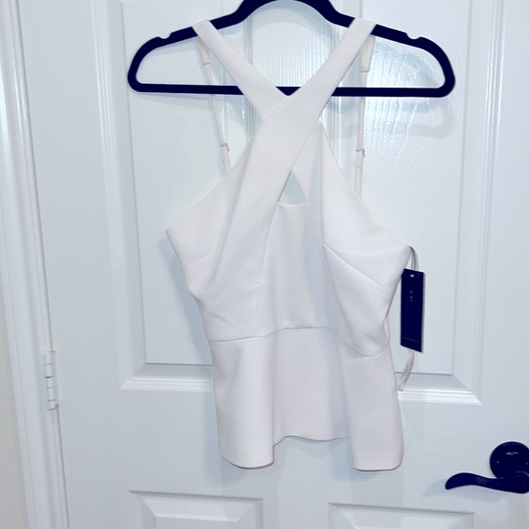 Never worn, white BCBG white halter top. Very classy and timeless - Picture 1 of 4